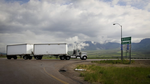 Tractor with double trailers making a turn.