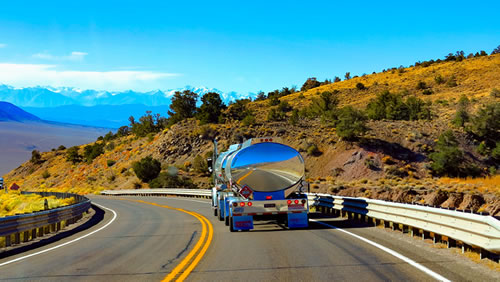 Tanker vehicle heading down the road.